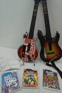lot 157 image: Wii Games & Accessories , Guitar Hero Games & 2 Guitar Hero