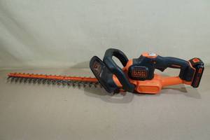 lot 6 image: Black  Decker 22 Hedge Trimmer with Battery