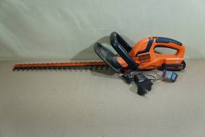 lot 176 image: Black  Decker 22 Hedge Trimmer with Battery and Charger