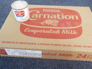 lot 84 image: 24 x 5 oz cans Nestle Carnation Evaporated Milk past best date