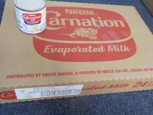 lot 86 image: 24 x 5 oz cans Nestle Carnation Evaporated Milk past best date