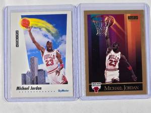 lot 191 image: Lot of 2 Michael Jordan - 1992 Skybox Skymaster No. 583, 1990 Skybox No. 41