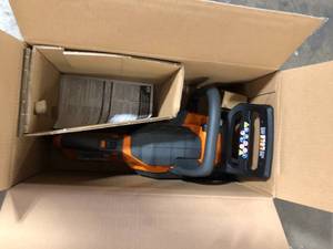 lot 50 image: RIDGID 18V Brushless 12 in. Electric Battery Chainsaw (Tool Only) Customer Returns See Pictures