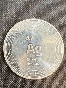 lot 23 image: 1 TROY OZ .999 FINE SILVER ELEMETAL ROUND