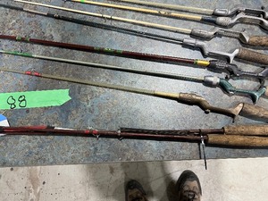 lot 88 image: TABLE FULL OF OLD RODS