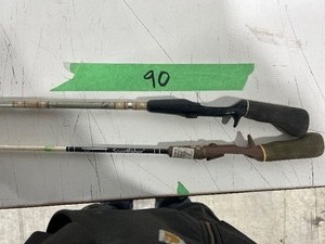 lot 90 image: TABLE FULL OF OLD RODS
