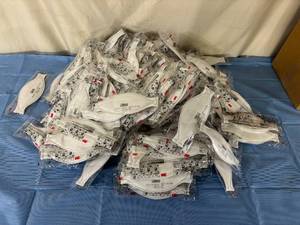 lot 163 image: MSRP $400  185 NEW 3M Aura 9210 N95 Disposable Particulate Respirator Face Masks -Convenient Individually Wrapped, Stapled Flat Fold Design, Low Profile Design Reduces Eyewear Fogging