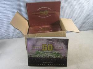 lot 184 image: (D-2) Case of 8 Celebrating Fifty Years Super Bowl Books 7 Hard Cover 1 Soft Cover - New