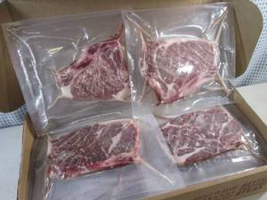 lot 271 image: (FRZ) 9 Pound Case Frozen Two Rivers Beef Strip Loin Steaks, Bone In (16 Steaks) Pack Date 090122