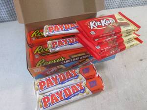 lot 285 image: (B-1) Box of 12 King Size Candy Bars 4 Each of Kit Kat, Pay Day and Reeses Peanut Butter Cups Best by Date Vary March - Aug 2024