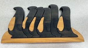 lot 48 image: Artisan Created Wooden Marching Penguin Puzzle Figurine