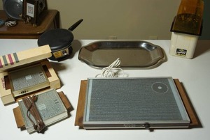 lot 210 image: Small Kitchen Appliances...West Bend Poppery 2 Popcorn Popper, Heat Pads Electric Tray Warmer, Sunbeam MSieur Electric Crepe Maker Model 30-10 Etc.