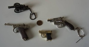 lot 34 image: Vintage Cap Toy Guns Cannon Etc.