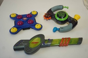 lot 42 image: Vintage Toys...NuJam Bop It Electronic Guitar Game Toy, Bop It Extreme 2 Push and Pull Game by Hasbro 1990s, Brain Bash Handheld Game 1994 Tiger Electronics...