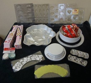 lot 50 image: A Whole Lot of Baking Products (Wilton Etc.) Table Top Scale, Cookie Cutters, Candy Molds and More