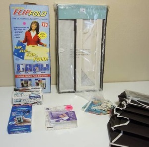 lot 66 image: Closet Clothing Organizers, FlipnFold Laundry Folder, MicroForce Worlds Smallest Shaver Etc.