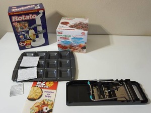 lot 67 image: Vintage ROTATO As seen on TV Manual Potato VeggieFruit Peeler wBonus Cutter, EZ Pockets, KitchenCraft 5-in-1 Adjustable Mandolin Slicer, Meatball Magic Meatball Maker