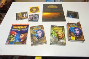 lot 107 image: World of Warcraft PCMAC-The Burning Crusade Expansion Set PC Game, Warcraft 2 Guide Book Battle Net Edition 1995-1999 Blizzard Metzen, World of Warcraft Hard Cover  and More...