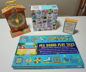 lot 167 image: Vintage Games Toys...1970s Halsam Play Tiles and Peg Board Vintage Set, 1968 Fisher Price Music Box Teaching Clock, Cupcake 1000 Piece Puzzle, 1983 Care Bears Card Game Which Bears Where Parker Brothers