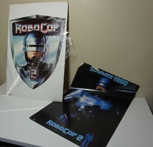 lot 197 image: Vintage Movie Posters...Summer 1990 ROBOCOP 2 One Stop Posters Orion Pictures, 1990 Robocop 2 Torso Image Police Badge Orion Pictures