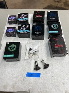 lot 42 image: LED Headlight Bulbs (not tested). Brands include Stone Banks, Alltimes, Islncer, Chusyyray