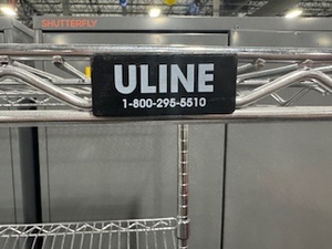 lot 13 image: Rolling Uline Slanted Wire Shelving