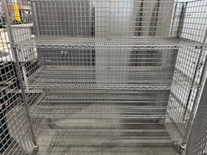 lot 139 image: Uline Cage with Four Shelves and Locking Wheels.