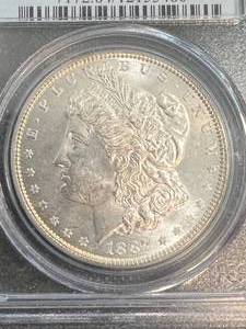 lot 50 image: 1887 US MORGAN SILVER DOLLAR PCGS MS64