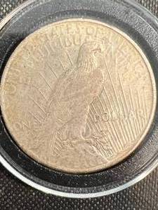 lot 52 image: 1925 US PEACE SILVER DOLLAR IN AIRTITE
