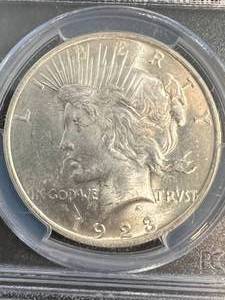 lot 65 image: 1923 US PEACE SILVER DOLLAR PCGS MS63