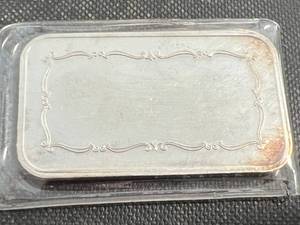 lot 76 image: 1 TROY OZ .999 FINE SILVER INTERNATIONAL TRADE UNIT BAR