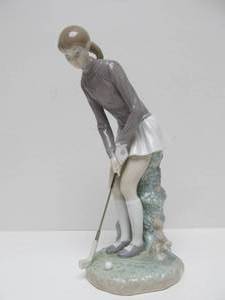 lot 62 image: LLADRO Porcelain Figurine - Young Lady Golfer