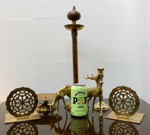 lot 143 image: Nice Group of Solid Brass Decor Pieces Tall Candles Stand Deer etc