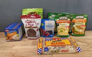 lot 128 image: Assortment of New Nonperishable Food Items New Mill Kluski, Lipton Recipe Secrets Onion Soup Mix, Dried Cranberries, Pecans, Bear Creek Soup Mixes H