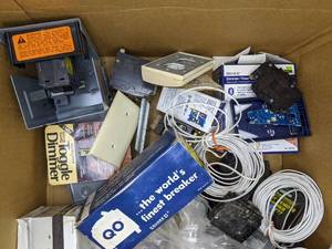 lot 172 image: Box of Miscellaneous Electrical Supplies Dimmers, Time Switches, Breakers, Lighting Switches, Wire Pulling Lubricant, Wing-Nuts, Plug-In Receiver, Outlets, Compression Connector and Much More H