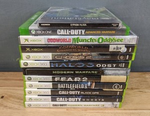 lot 17 image: 12 PlayStationXbox One Xbox Xbox 360 Games Syphon Filter, COD Advanced Warfare, Oddworld Munchs Oddysee, Oddworld Strangers Wrath, Crysis 2, Halo 3, Modern Warfare 2, Fear 2, Battle Field 3, COD Black Ops, COD Ghosts and COD Modern Warfare 3 H