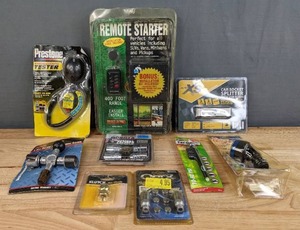 lot 141 image: New Antifreeze Coolant Tester, Car Socket Splitter, Remote Starter, 4-Way Battery Post & Terminal Cleaner, Wheel Locks, Etc. H