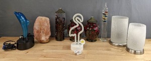 lot 203 image: Table Glass Votives, Flamingo Lamp, Dolphin Lamp, Salt Lamp, Glass Dcor, Vases, Etc. H