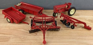 lot 159 image: ERTL Toy International Red Tractor plus (2) Toy Plows and (2) Toy Trailers H