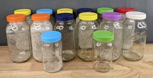 lot 211 image: 14 Glass Mason Jars with Colorful Lids H