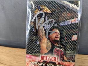 lot 38 image: 2018 Topps Roman Reigns Autographed WWE Hell in a Cell Wrestling Card I
