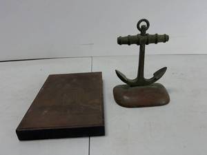 lot 204 image: U.S. NAVY BRASS ANCHOR DOOR STOP DECOR PAPER WEIGHT AND U.S. NAVY RUBBING PLAGUE FOR CARDS OR DECOR