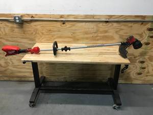 lot 38 image: Milwaukee M18 Brushless String Trimmer Cat. No. 2828-20