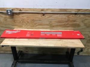 lot 23 image: Milwaukee 55inch Guide Rail (retail $90)