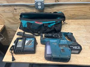 lot 129 image: MAKITA Hammer Drill with HEPA Filter, Charger, Bag and 1- 3Ah Battery