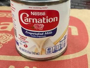 lot 186 image: Nestle Carnation Evaporated Milk 24 pack 5oz tins