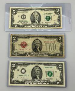 lot 12 image: Misc. U.S. Two Dollar Bills Including 1928 G Red Seal, 2003 A And 2013
