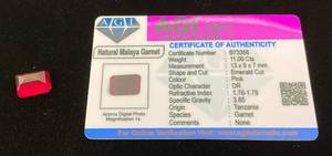 lot 29 image: AGI Labs 11.00 Cts Emerald Cut Natural Malaya Garnet With COA