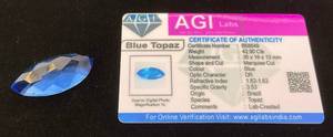 lot 33 image: AGI Labs 42.90 Cts Marquise Cut Blue Topaz