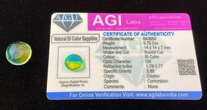 lot 40 image: AGI Labs 9.75 Cts Round Cut Natural Bi Color Sapphire With COA